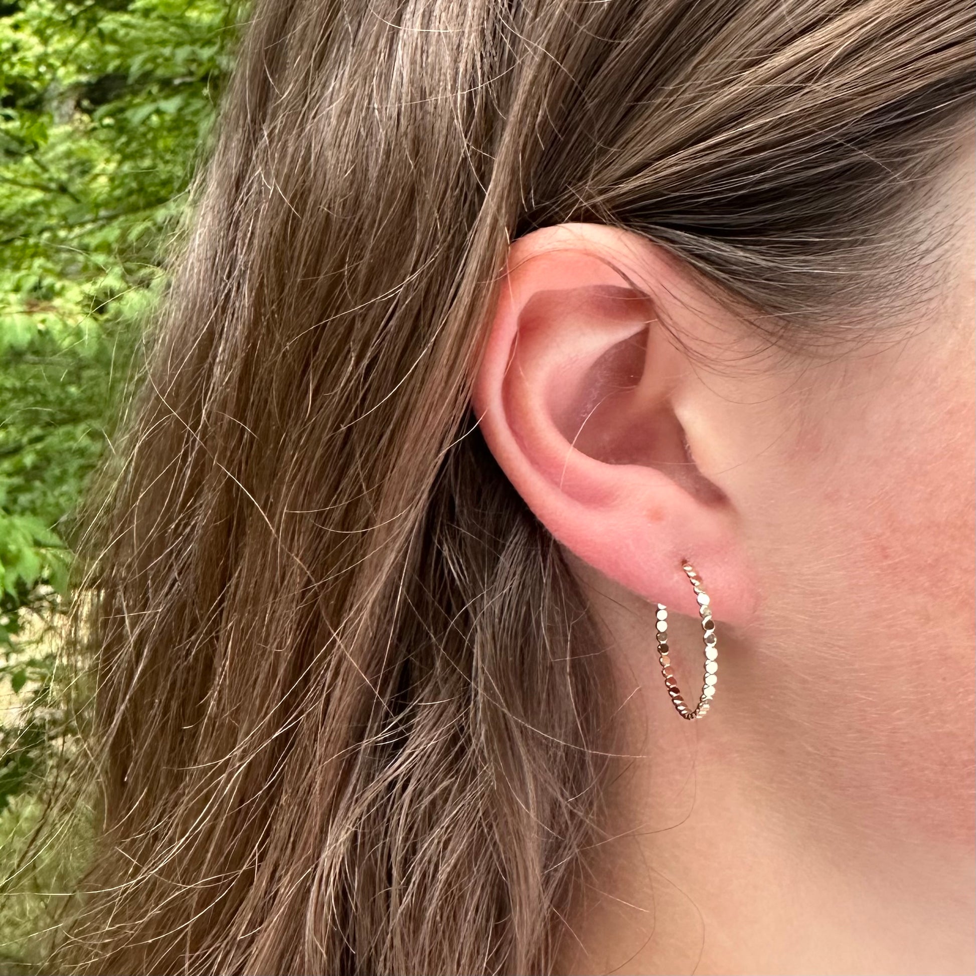 Gold flat bead post hoop earring in different sizes with push back, lightweight delicate hoop earring. Handmade gold jewelry by hanni jewelry, harbor springs, michigan