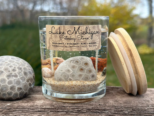 Gel candle, petoskey stone, leland blue, pudding stone, agate, sodalite, treasures remain after candle burns down, woodsy scent, 8 ounce, hanni gallery