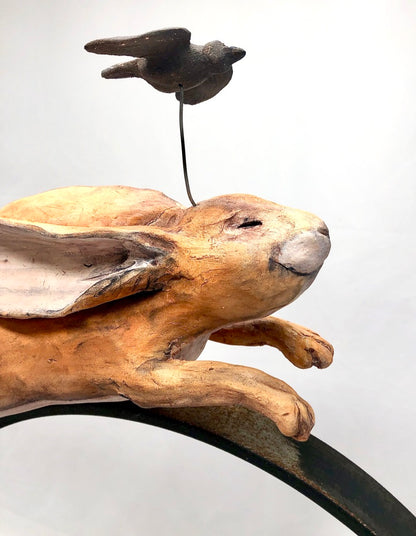 Ceramic Sculpture, Two Hares on Metal Ring: "Let Your Greatness Show From Your Inner Light"