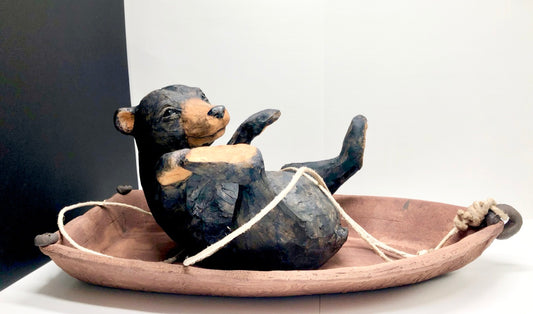 Ceramic sculpture, black bear in a boat, tangled up, fun piece, local artisan