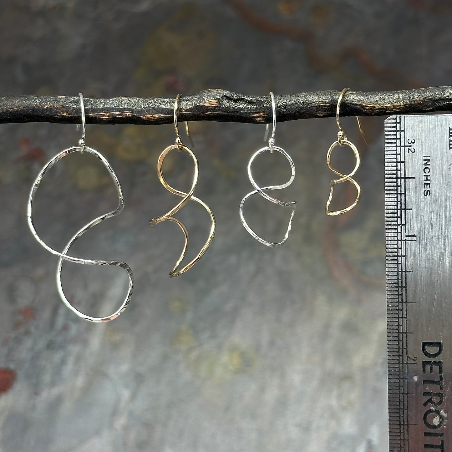 Twisty spiral wire earring in sterling silver or 14kt gold filled, Simple modern dangle in four sizes 1 to 2 inches long, available on french hook or leverback ear wires, artist handmade by hanni jewelry in harbor springs, michigan