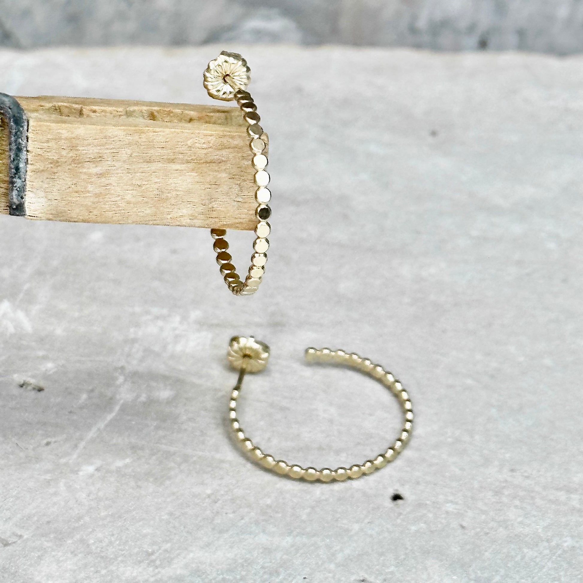 Gold flat bead post hoop earring in different sizes with push back, lightweight delicate hoop earring. Handmade gold jewelry by hanni jewelry, harbor springs, michigan