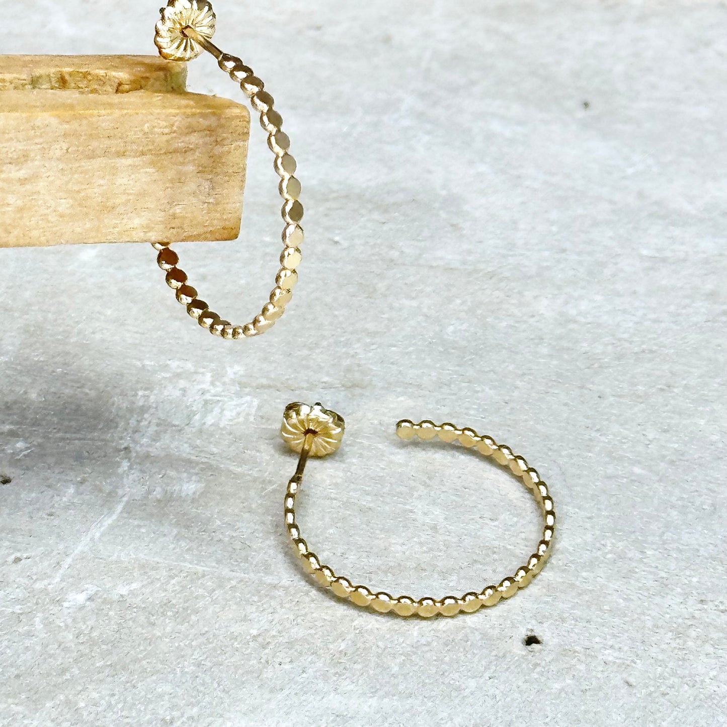 Gold flat bead post hoop earring in different sizes with push back, lightweight delicate hoop earring. Handmade gold jewelry by hanni jewelry, harbor springs, michigan