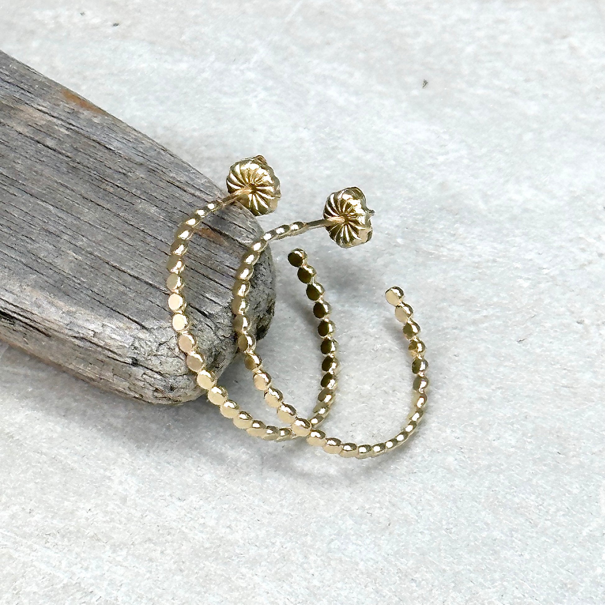 Gold flat bead post hoop earring in different sizes with push back, lightweight delicate hoop earring. Handmade gold jewelry by hanni jewelry, harbor springs, michigan