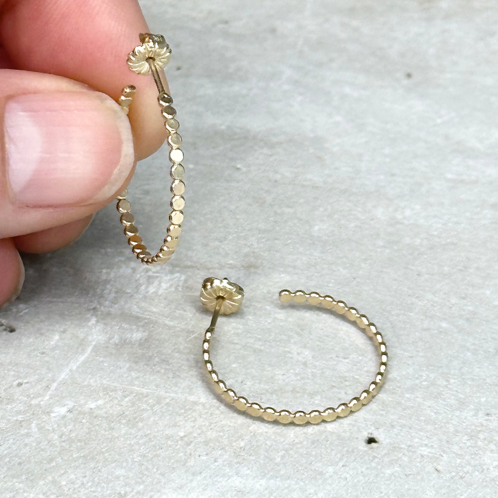 Gold flat bead post hoop earring in different sizes with push back, lightweight delicate hoop earring. Handmade gold jewelry by hanni jewelry, harbor springs, michigan