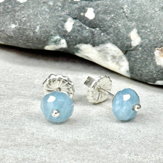 Faceted Aquamarine post stud earring, sterling silver with pinned ball of silver in the center, about 1/4 inch across with sterling silver push back. Handmade sterling silver artist jewelry by Hanni Jewelry, Harbor Springs, Michigan.