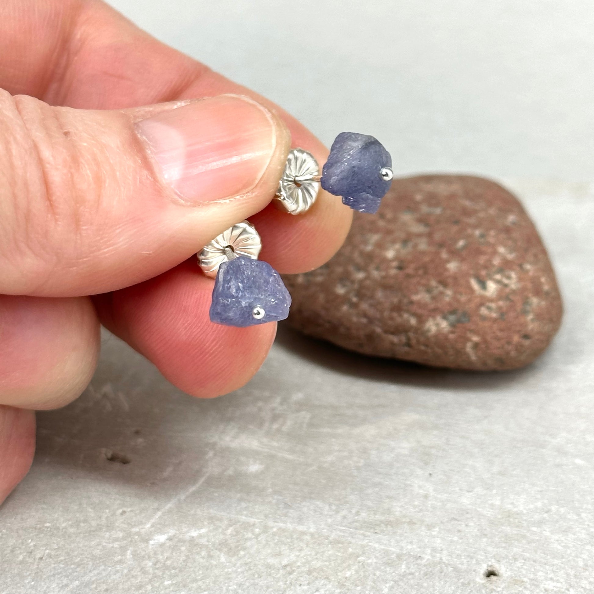 raw tanzanite post earring pinned with sterling silver artisan handmade jewelry by hanni