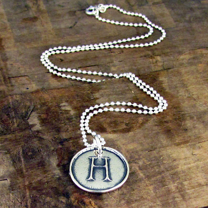 round raised sterling silver letter necklace artisan handmade jewelry by hanni jewelry harbor springs michigan