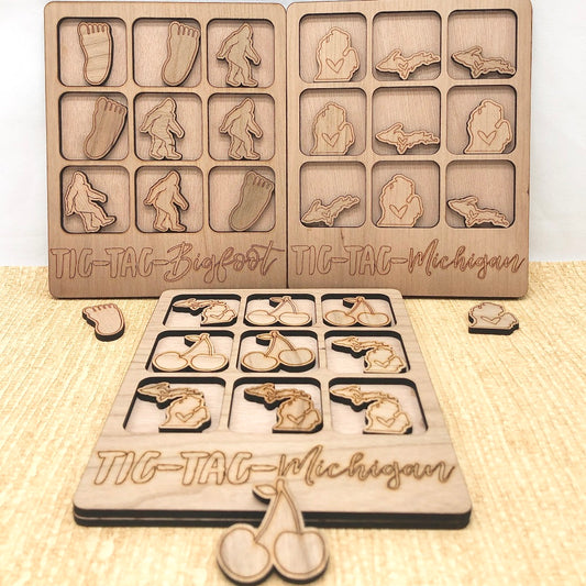 Small wooden tic-tac-toe board, pieces shaped like Michigan, upper peninsula, bigfoot, locally made, hanni gallery, harbor springs